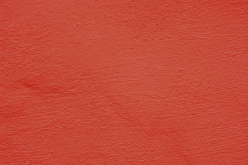 Background of a red stucco coated and painted exterior, rough cast of cement and concrete wall...