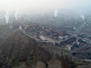 Aerial view of big factory in China.Air pollution by smoke coming out of chimneys. Coal Fossil Fuel...