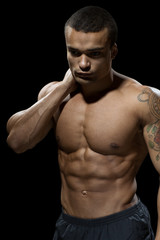 Fototapeta premium Hard work pays off. Handsome young bodybuilder showing off his hot body