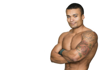 Feeling strong and healthy. Young handsome fitness man smiling to the camera isolated on white