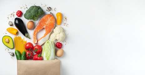 Supermarket. Paper bag full of healthy food.