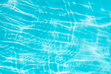 Fototapeta na wymiar Blue water in swimming pool background