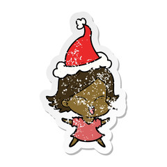 happy distressed sticker cartoon of a girl wearing santa hat