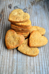 Gingerbread cookies in shape of heart on wooden table
