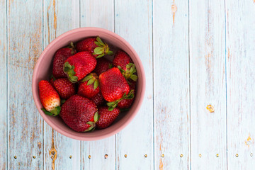 Sweet, juicy, ripe strawberries. Red, large strawberries in a pink cup. Food with vitamins. Vegetarian food.