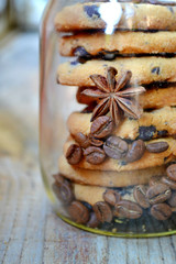 Jar of sweet and delicious chocolate cookies with coffee beans and anise stars