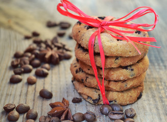 Tasty chocolate cookies on wooden table