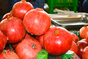 Mountain of fruits, pomegranates, in the bazaar.