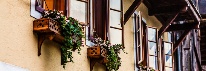 Fototapeta na wymiar Beautiful street decorated with flowers in Italy