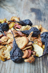 Dry apples and pears on wooden table