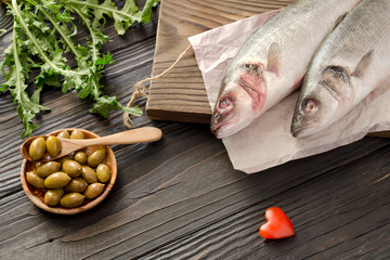 European bass (Dicentrarchus labrax) on a wooden table