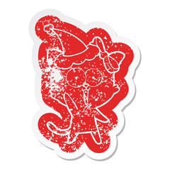 cartoon distressed sticker of a cat wearing santa hat