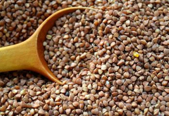 Buckwheat grains on wooden table