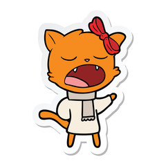 Obraz na płótnie Canvas sticker of a cartoon cat in winter clothes