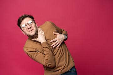 I'm afraid. Fright. Portrait of the scared man isolated on trendy pink studio background. Male half-length portrait. Human emotions, facial expression concept