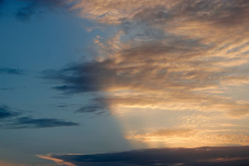 Fototapeta na wymiar Evening sky with clouds and sunny rays. Sunset of sun