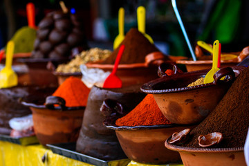 Several handmade clay pot with podwer to prepare traditional mexican dish mole - obrazy, fototapety, plakaty