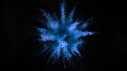 Super slowmotion shot of blue powder explosion isolated on black background.