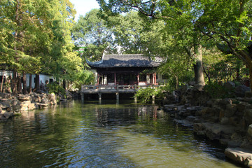 Calm chinese Yuyuan garden in the center of busy Shanghai city