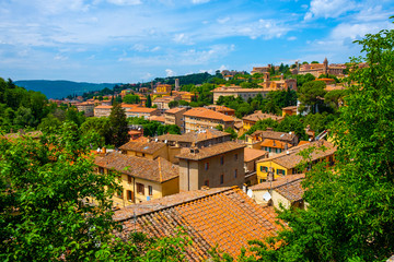 Fototapeta na wymiar Perugia, Italy - Panoramic view of the Perugia historic quarter with medieval houses and academic quarter of University of Perugia and other academies