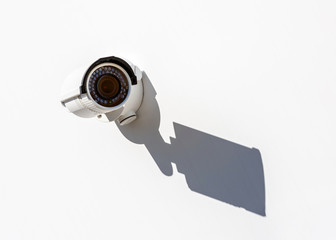 Modern mini CCTV camera on the wall of an industrial building