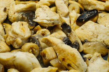 Roasted chicken being cooked in the pan with cream sauce