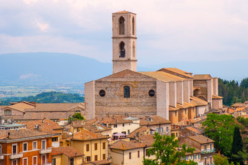 Fototapeta na wymiar Perugia, Umbria / Italy - 2018/05/28: Panoramic view of Perugia and Umbria region mountains and hills with St. Domenico Basilica - Basilica di San Domenico
