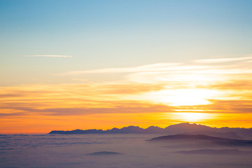 Fototapeta na wymiar Mountain silhouette at sundown