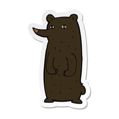 sticker of a funny cartoon black bear