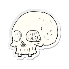 sticker of a cartoon old skull