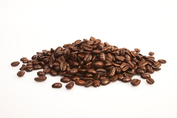Several coffee beans on a white background