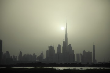 Dubai skyline silhouette at sunset