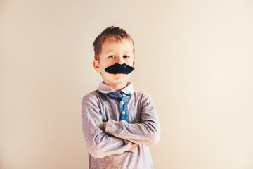 Child with mustache isolated on white.