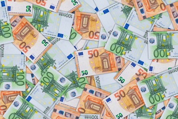 Fototapeta na wymiar Background from a of fifty and hundred euro banknotes