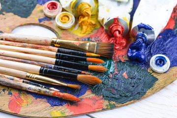 Paint brushes and paints for drawing.