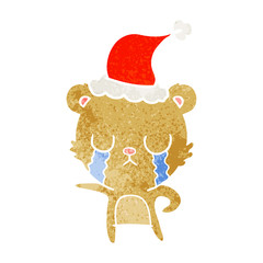 crying retro cartoon of a bear wearing santa hat
