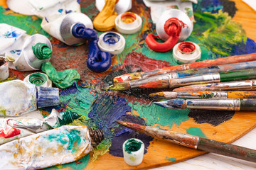 Paint brushes and paints for drawing.