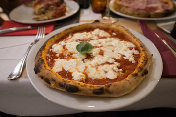 Margherita Pizza is a traditional italian pizza ffrom Napoli with mozzarella and tomato