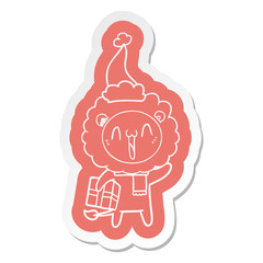 happy cartoon  sticker of a lion wearing santa hat