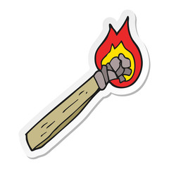 sticker of a cartoon burning wood torch