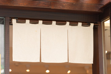 The curtain-like fabric that hangs in front of traditional Japanese restaurants and shops not only serves as a signboard, but holds a larger meaning,