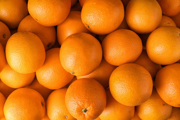 Pile of fresh ripe oranges as background, top view