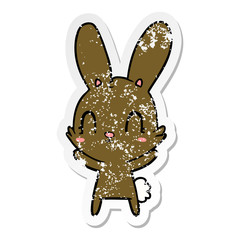 distressed sticker of a cute cartoon rabbit