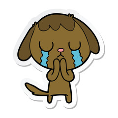 sticker of a cute cartoon dog crying