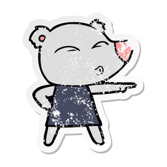 distressed sticker of a cartoon whistling bear in dress