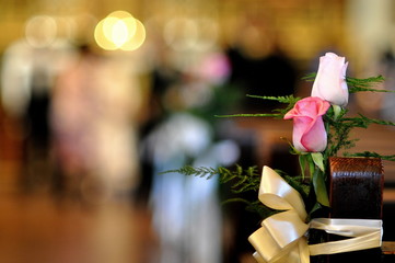 Wedding flowers on the pew