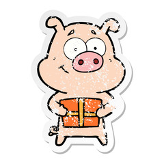distressed sticker of a happy cartoon pig holding christmas present