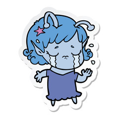 sticker of a cartoon crying alien girl