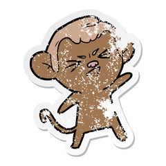distressed sticker of a cartoon annoyed monkey