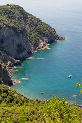 Fotobehang Italy, Cinque Terre, Corniglia, an island in the middle of a body of water © SkandaRamana